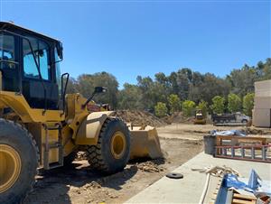 A worker prepares the site for building.